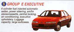 6 cylinder, fuel injected automatic sedan,  power steering, am/fm stereo/cassette, central locking, air conditioning, executive upholstery. Luggage capacity = medium suitcases